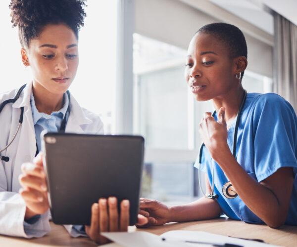 Tablet, black people or nurses with medical research reading news or tests results in hospital together. Teamwork, digital tech or African doctors planning or speaking of healthcare report on website Tablet, black people or nurses with medical research reading news or tests results in hospital together. Teamwork, digital tech or African doctors planning or speaking of healthcare report on website.