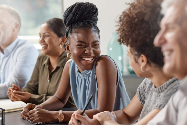 Laughter can brighten up your day. Shot of a group of businesspeople in a meeting at work. Shot of a group of businesspeople in a meeting at work.